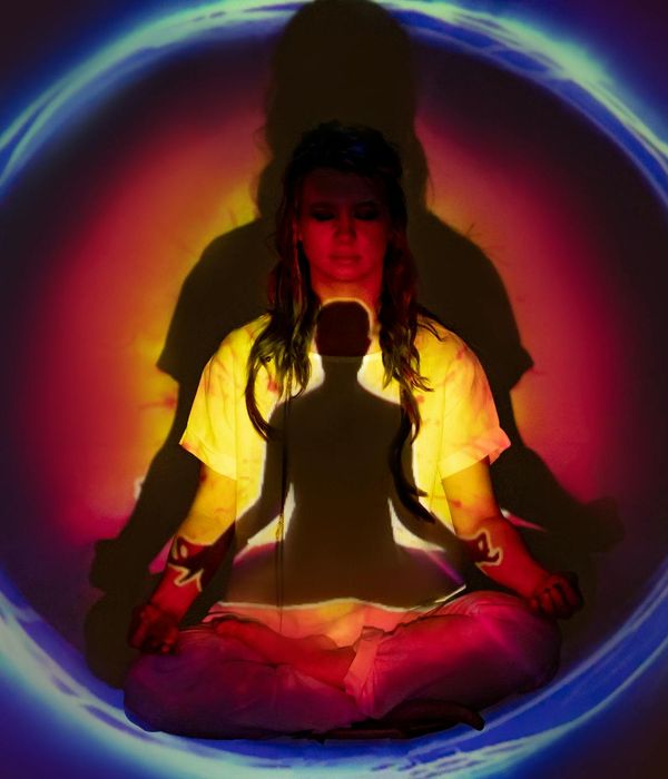 Woman holding a mindful yoga pose with a calm expression, lemon and blue colors.